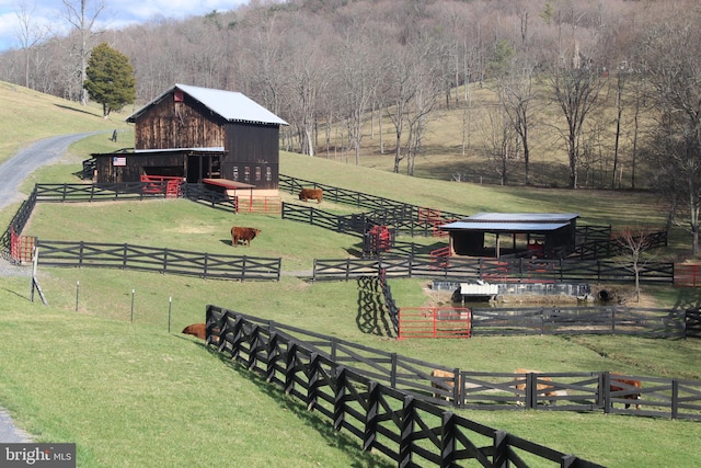 surrounding community featuring an outdoor structure, an exterior structure, and a rural view