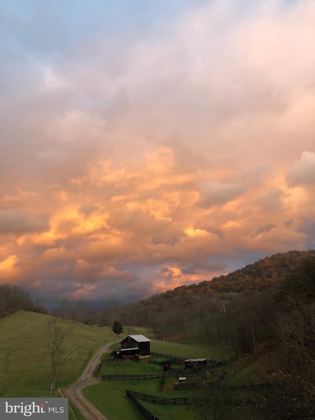 mountain view featuring a rural view