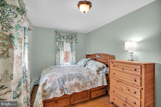 bedroom featuring light wood-style flooring