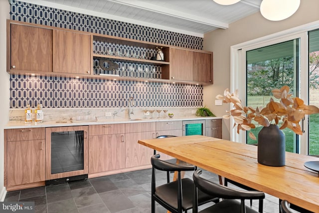 7030 Oregon Ave NW, Washington, DC 20015 - bar featuring beamed ceiling, beverage cooler, decorative backsplash, and indoor wet bar