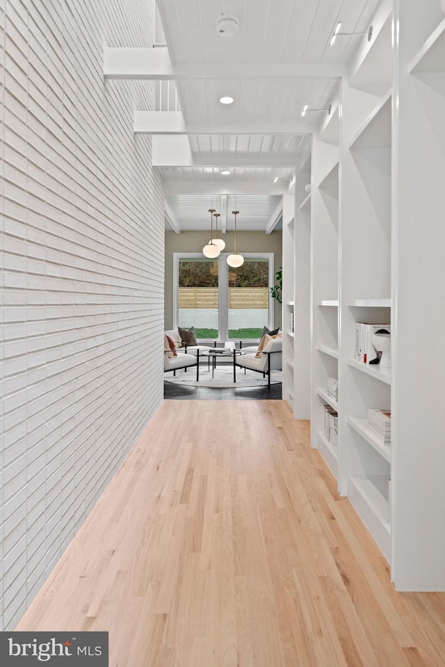 7030 Oregon Ave NW, Washington, DC 20015 - hall featuring light wood-type flooring, wood walls, and built in shelves