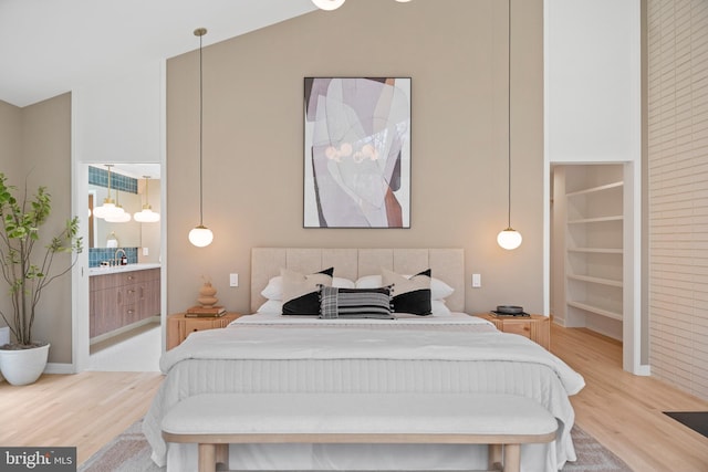 7030 Oregon Ave NW, Washington, DC 20015 - bedroom with light wood-style flooring, high vaulted ceiling, and ensuite bathroom