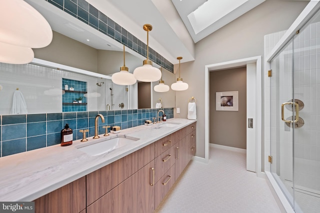 7030 Oregon Ave NW, Washington, DC 20015 - bathroom with lofted ceiling with skylight, a sink, double vanity, and a stall shower