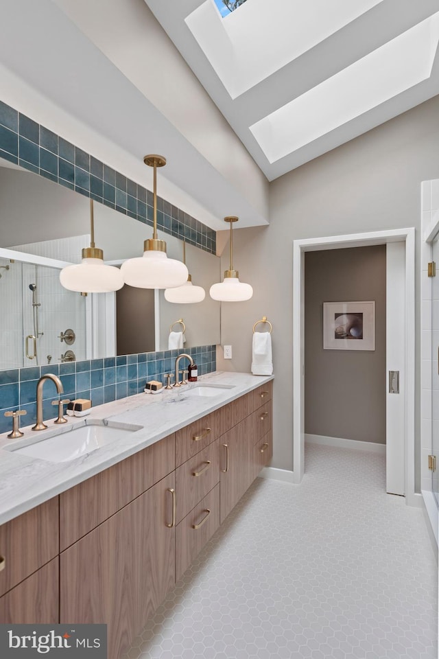 7030 Oregon Ave NW, Washington, DC 20015 - bathroom featuring a shower stall, a sink, double vanity, and a skylight