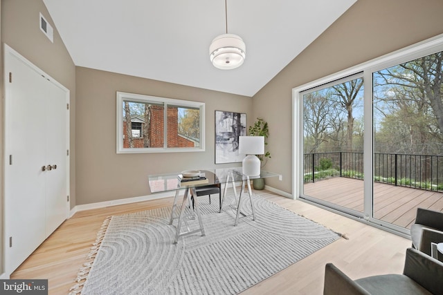 7030 Oregon Ave NW, Washington, DC 20015 - home office featuring visible vents, plenty of natural light, vaulted ceiling, and wood finished floors