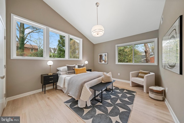7030 Oregon Ave NW, Washington, DC 20015 - bedroom with light wood-style floors, vaulted ceiling, and baseboards