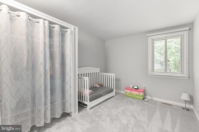 6266 Occoquan Forest Dr, Manassas, VA 20112 - bedroom with carpet flooring, baseboards, and a crib