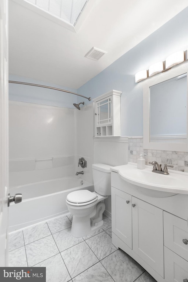6266 Occoquan Forest Dr, Manassas, VA 20112 - full bathroom featuring toilet, vanity,  shower combination, marble look tiles, and a wainscoted wall