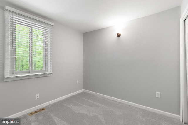 6266 Occoquan Forest Dr, Manassas, VA 20112 - carpeted empty room with plenty of natural light and baseboards