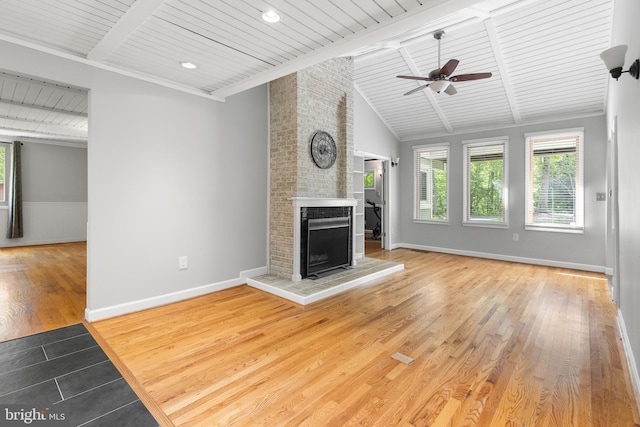 6266 Occoquan Forest Dr, Manassas, VA 20112 - unfurnished living room with wood ceiling, wood finished floors, a fireplace, a ceiling fan, and baseboards