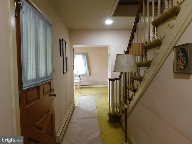 hallway featuring a baseboard heating unit, stairway, recessed lighting, and light colored carpet