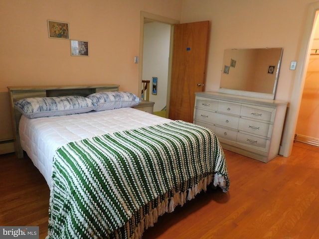 bedroom with wood finished floors