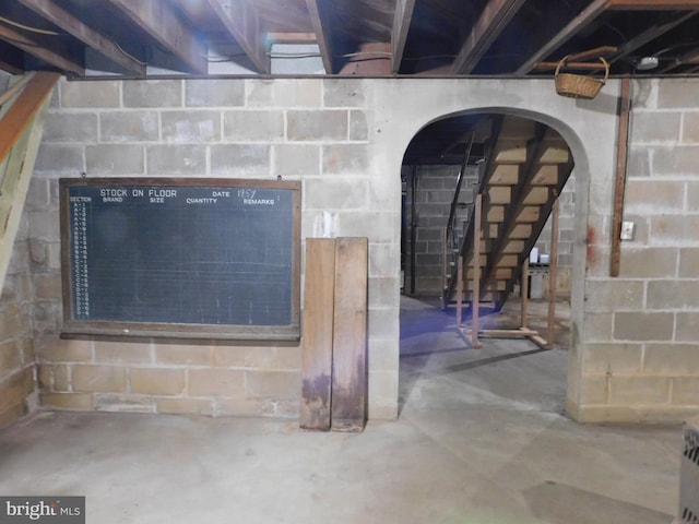 details with concrete block wall and unfinished concrete floors