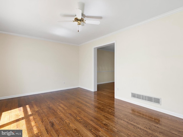 666 Clifton Dr, Bear, DE 19701 - unfurnished room featuring baseboards, wood finished floors, visible vents, and crown molding