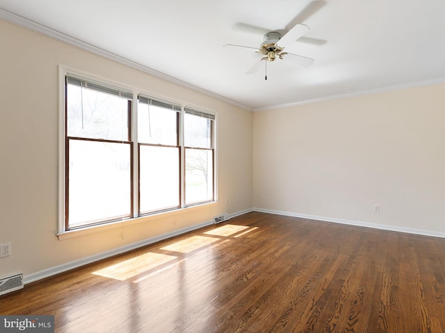 666 Clifton Dr, Bear, DE 19701 - unfurnished room featuring visible vents, dark wood finished floors, ceiling fan, and crown molding