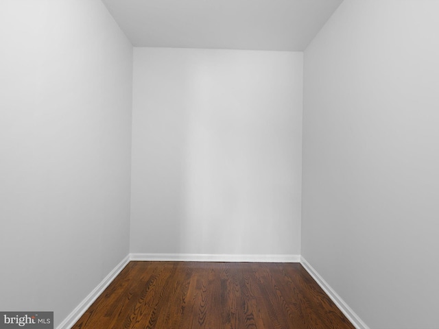 666 Clifton Dr, Bear, DE 19701 - spare room with baseboards and dark wood-type flooring