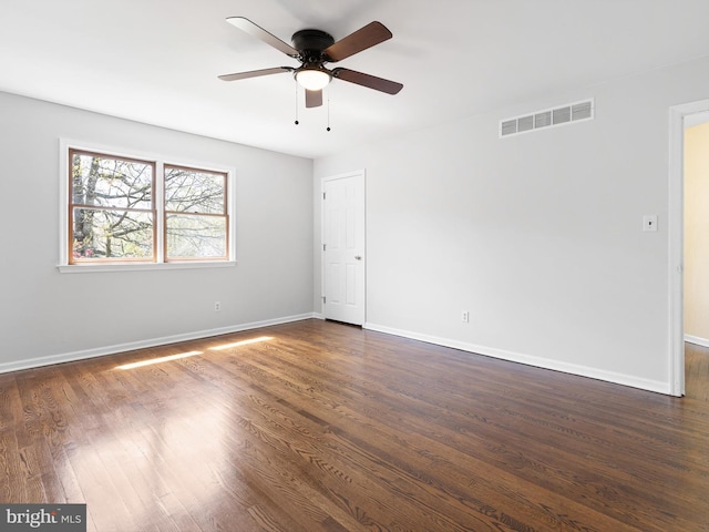 666 Clifton Dr, Bear, DE 19701 - spare room featuring dark wood finished floors, visible vents, baseboards, and ceiling fan