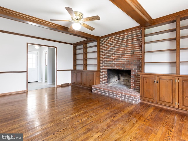 666 Clifton Dr, Bear, DE 19701 - unfurnished living room with wood finished floors, beam ceiling, built in features, and ceiling fan