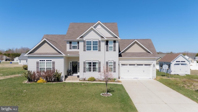 69 Amanda Ave, Greenwood, DE 19950 - view of front of house with a shingled roof, a garage, concrete driveway, and a front yard