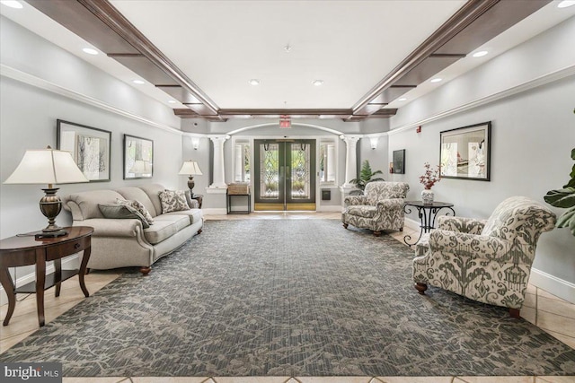 tiled living area featuring recessed lighting, decorative columns, and baseboards
