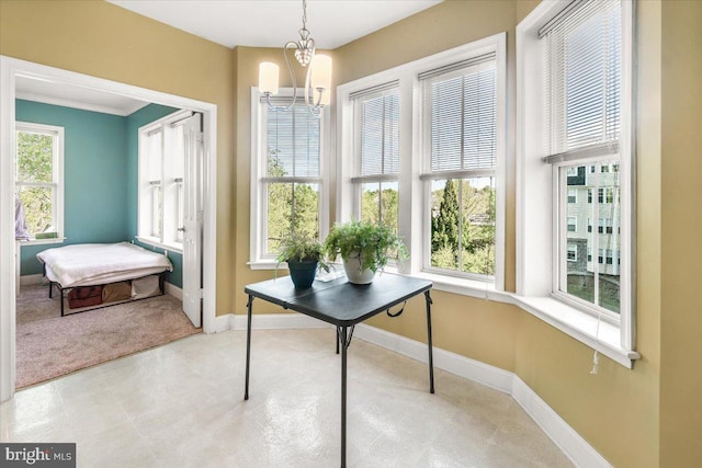 office area featuring baseboards, a chandelier, and carpet