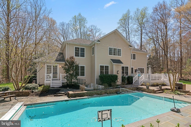 pool with a deck and a patio area