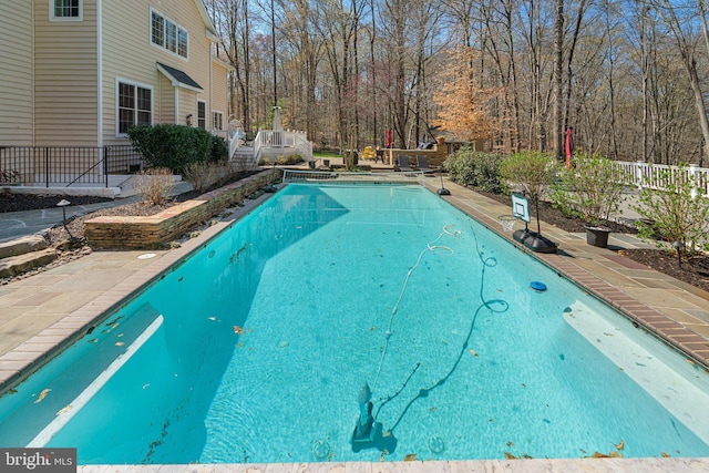 view of pool featuring fence