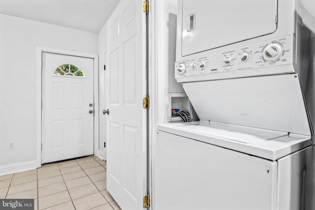 1508 V St SE, Washington, DC 20020 - laundry room featuring laundry area, stacked washer and clothes dryer, baseboards, and light tile patterned floors
