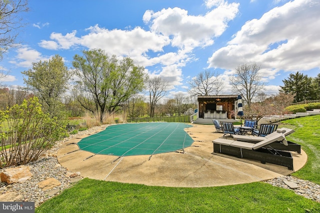 view of pool with fence, a fenced in pool, and a patio