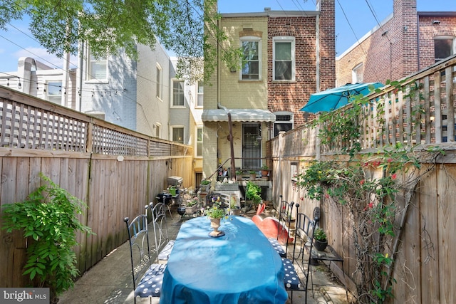 view of patio / terrace with outdoor dining area and a fenced backyard