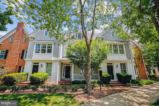 979 Powhatan St, Alexandria, VA 22314 - view of front of house featuring a porch and brick siding