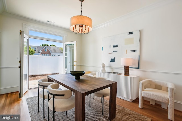 979 Powhatan St, Alexandria, VA 22314 - dining space featuring visible vents, ornamental molding, radiator heating unit, and light wood-style floors
