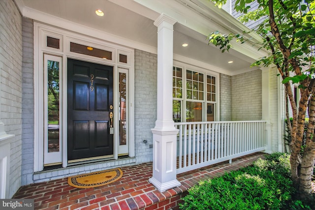 979 Powhatan St, Alexandria, VA 22314 - doorway to property featuring brick siding and covered porch