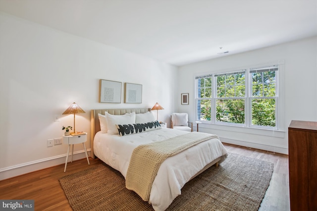 979 Powhatan St, Alexandria, VA 22314 - bedroom with baseboards and wood finished floors