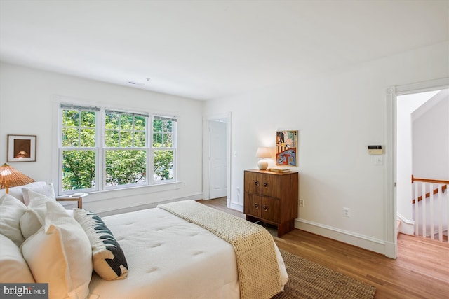 979 Powhatan St, Alexandria, VA 22314 - bedroom featuring baseboards, wood finished floors, and visible vents
