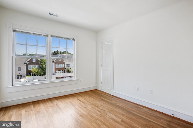 979 Powhatan St, Alexandria, VA 22314 - spare room featuring baseboards, wood finished floors, and visible vents