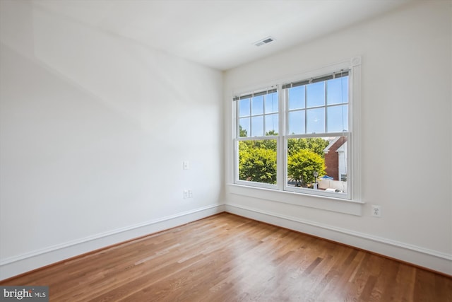 979 Powhatan St, Alexandria, VA 22314 - spare room featuring visible vents, baseboards, and wood finished floors