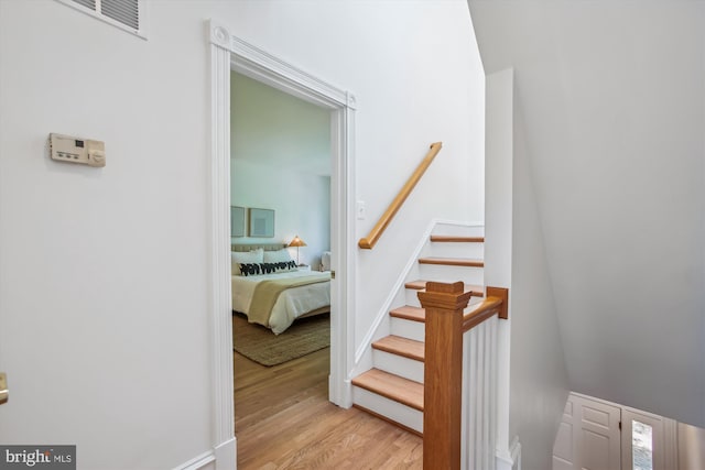 979 Powhatan St, Alexandria, VA 22314 - staircase with baseboards, visible vents, and wood finished floors