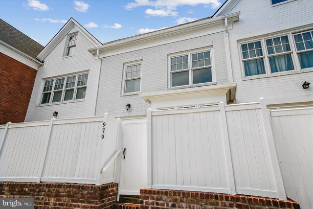 979 Powhatan St, Alexandria, VA 22314 - exterior space featuring brick siding and fence