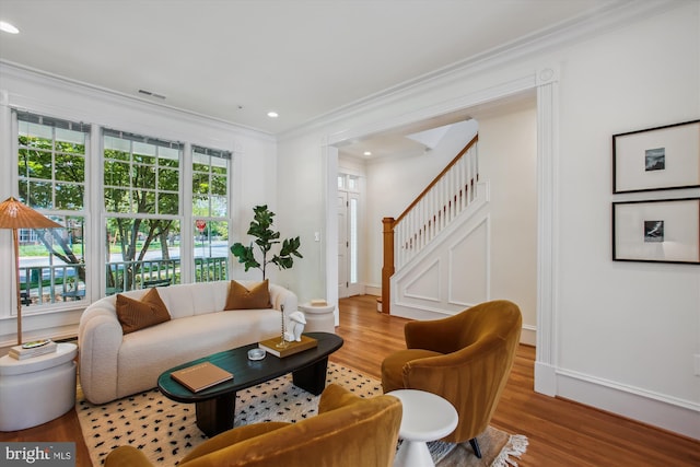 979 Powhatan St, Alexandria, VA 22314 - living area featuring visible vents, wood finished floors, stairway, ornamental molding, and recessed lighting