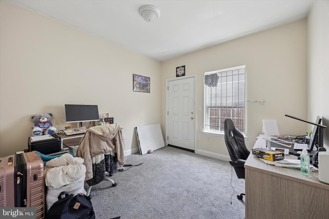 carpeted office space featuring baseboards