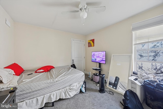 carpeted bedroom with ceiling fan