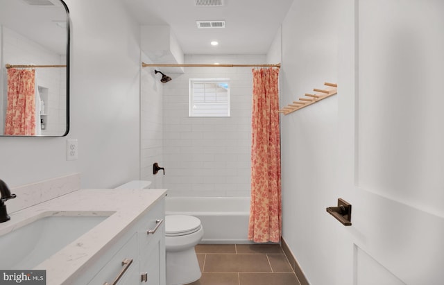 full bathroom featuring tile patterned flooring, toilet, shower / tub combo with curtain, vanity, and baseboards