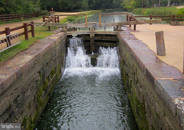 dock with a water view and a forest view