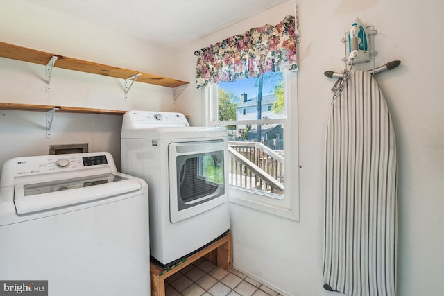 15690 Buck Ln, Dumfries, VA 22025 - laundry area featuring light tile patterned flooring, washer and dryer, and laundry area