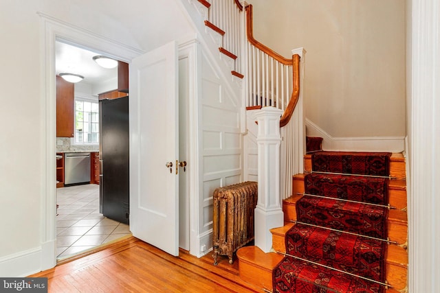 stairs with wood finished floors