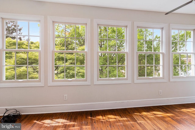 unfurnished sunroom with a wealth of natural light