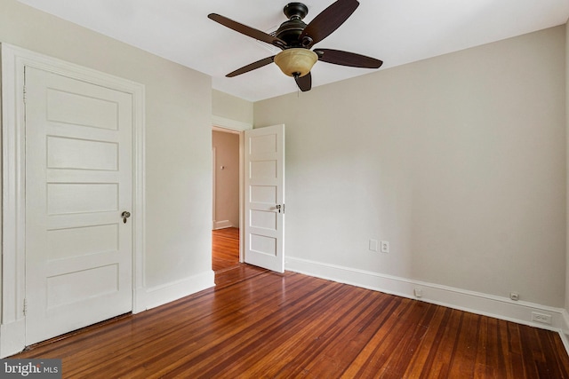 unfurnished bedroom with baseboards, ceiling fan, and wood finished floors