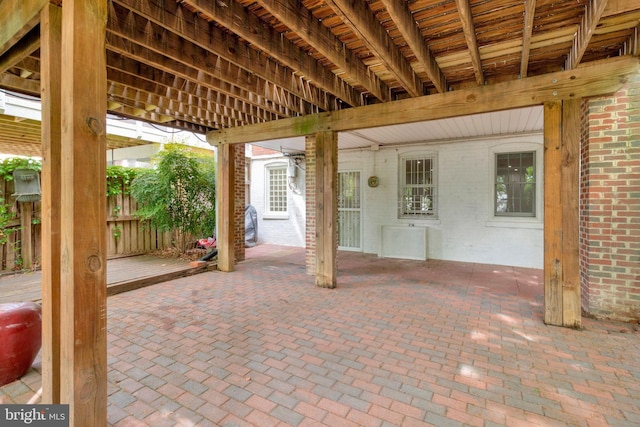 view of patio featuring fence