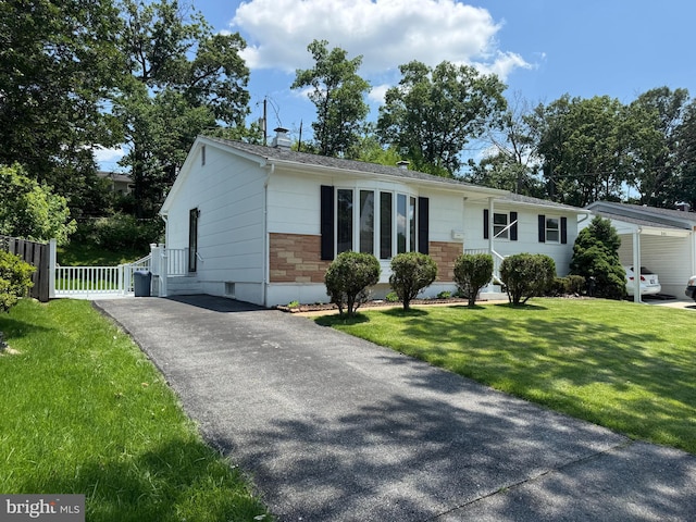 243 Ironshire S, Laurel, MD 20724 - single story home with driveway, stone siding, and a chimney